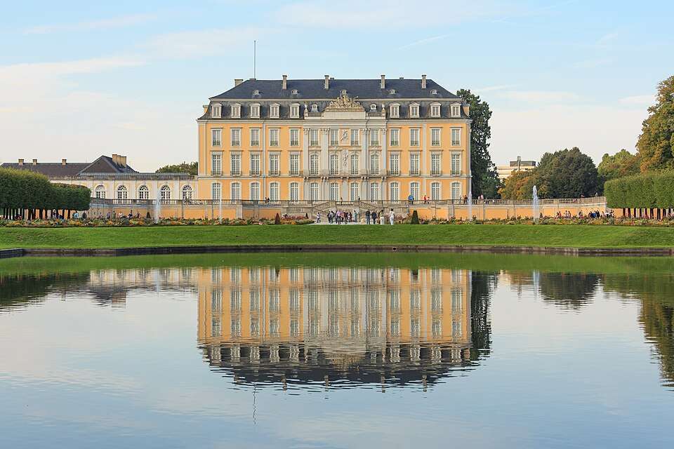Schloss Augustusburg reflected in its garden pond, Brühl