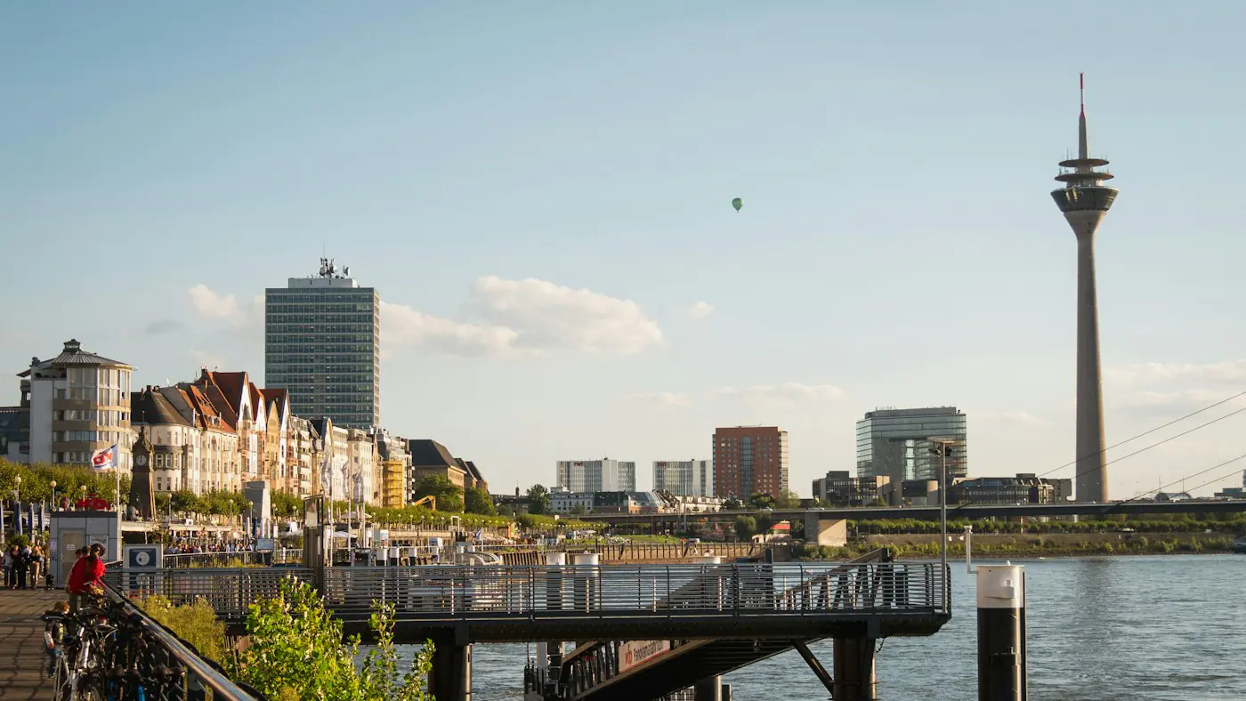 The Rhine promenade in Düsseldorf with the Rheinturm tower downstream