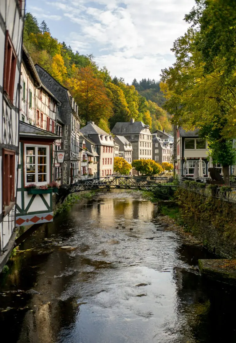 Half-timbered houses of Monschau leaning over the River Rur in autumn