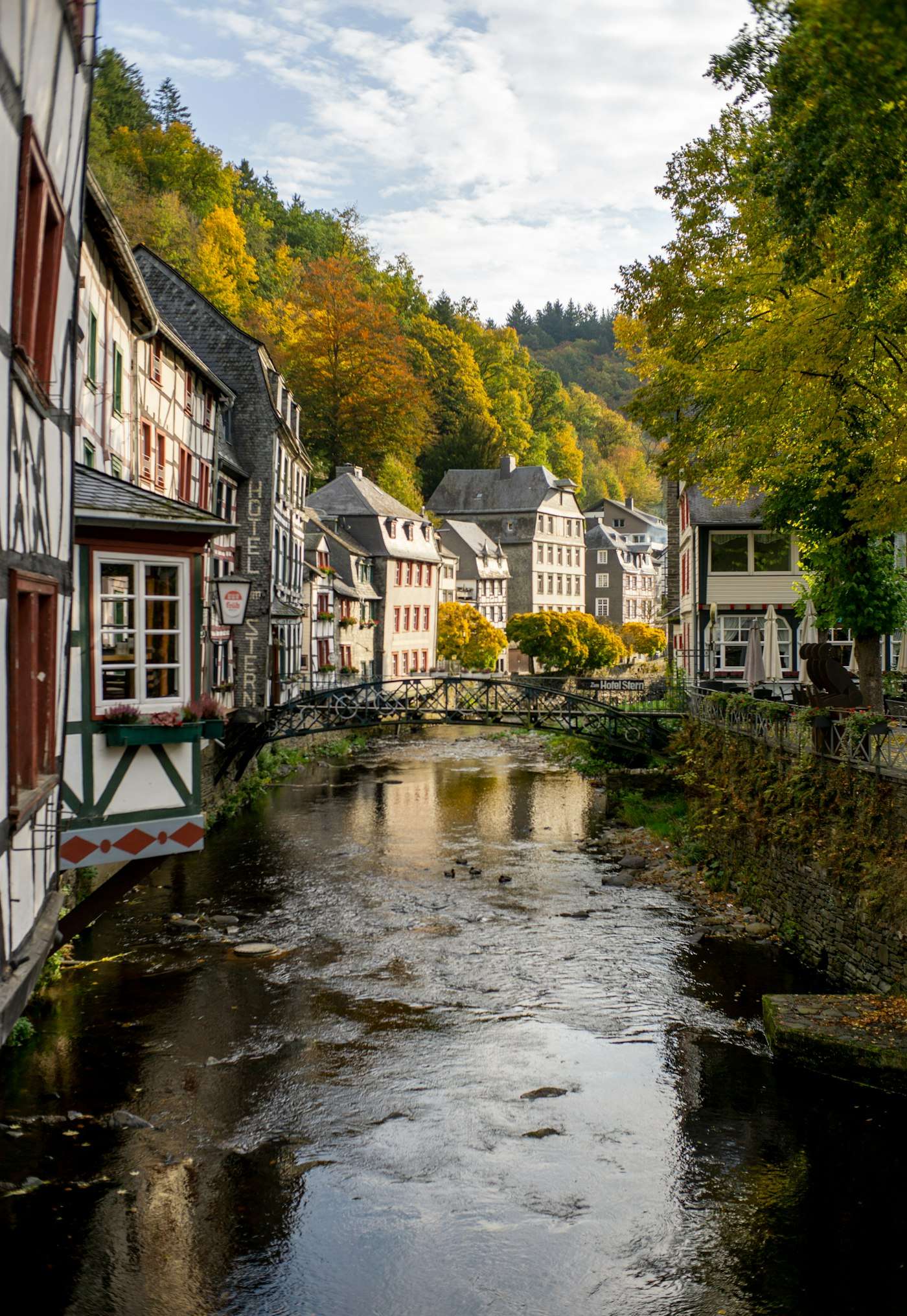 Half-timbered houses of Monschau leaning over the River Rur in autumn